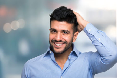 Man touching his hair Man touching his hair